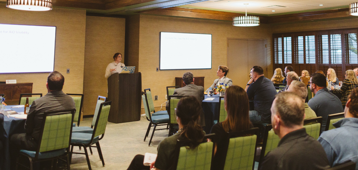 Speaker presenting "The SEO Reset" to an audience at the St. Louis Marketing Disrupted event.